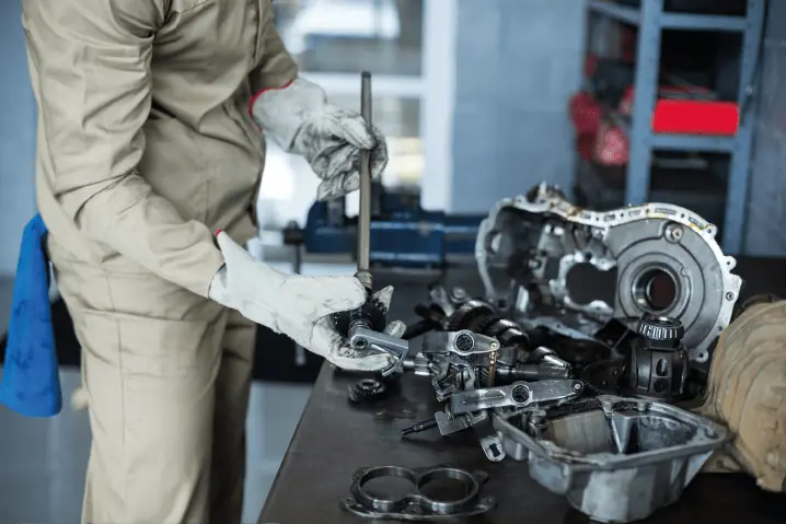 Artisan repairing an engine component at MM Engineering